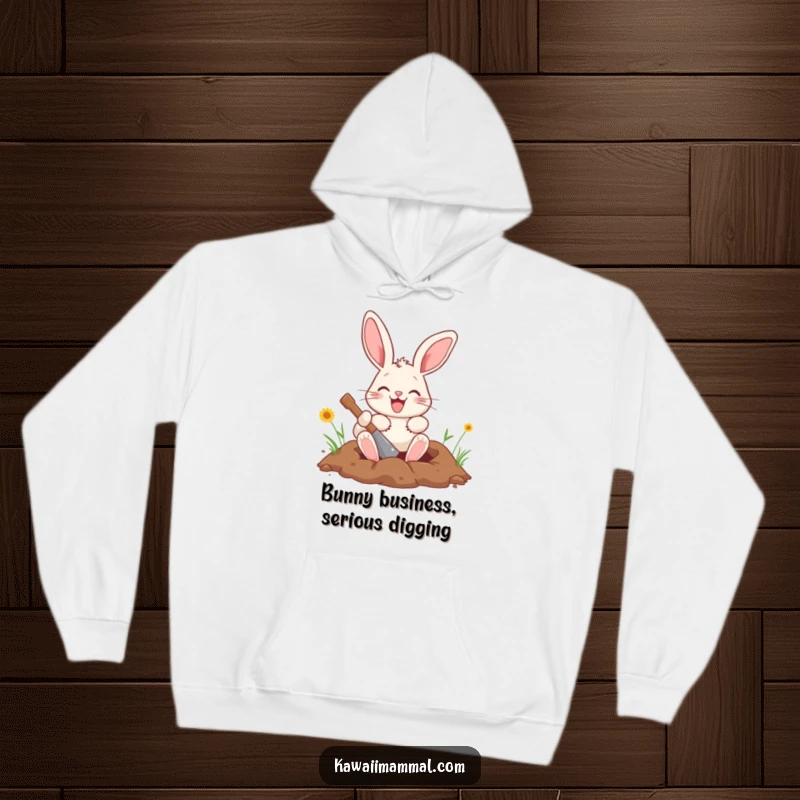 Funny bunny hoodie featuring a happy character digging a hole with its paws, designed for warmth and humorous style.