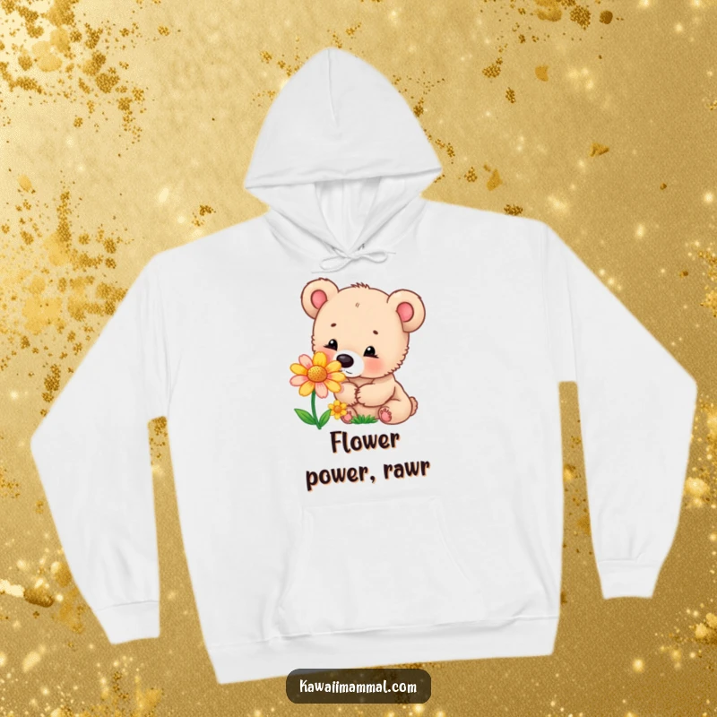 Funny hoodie featuring a curious bear cub sniffing a colorful flower, designed for warmth and embracing a sense of wonder.