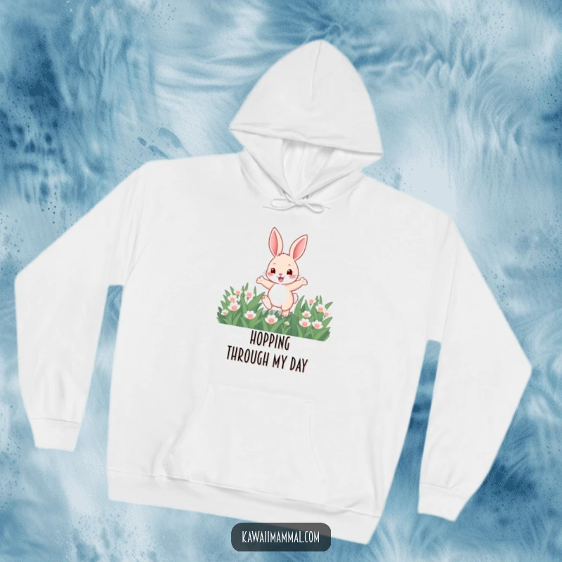 Funny hoodie depicting a cute, animated bunny energetically hopping through a clover patch, radiating warmth and playful energy.