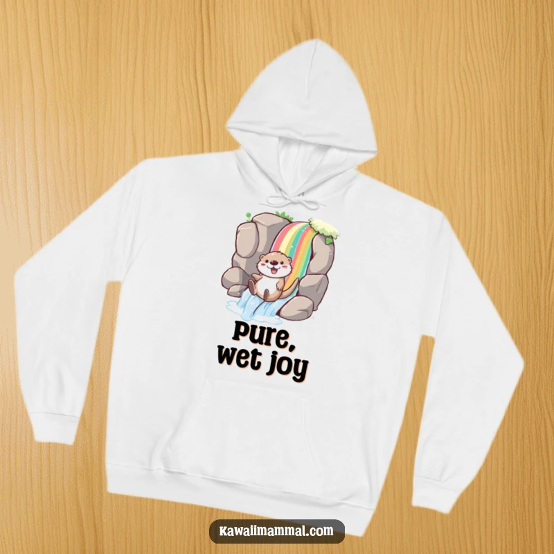 Funny otter hoodie with a playful character joyfully sliding down a rainbow waterfall, offering cozy warmth and a splash of vibrant joy.