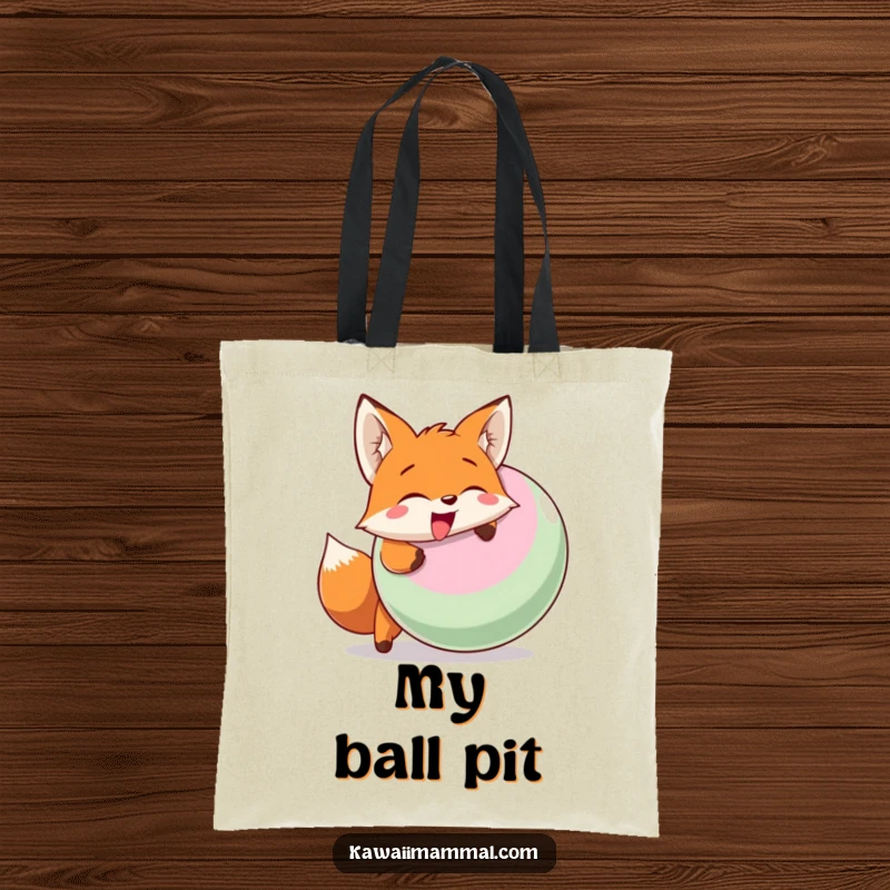 Funny tote bag depicting a happy fox character enthusiastically head-butting a large inflatable ball with a joyful expression.